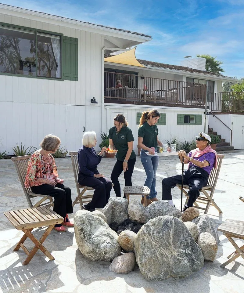 Caregiver serving a resident in the Casa La Granada backyard